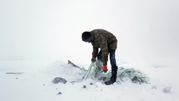 Fisherman on A Lake at Winter