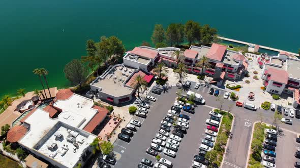 Aerial drone rotation over businesses on community lake mission viejo