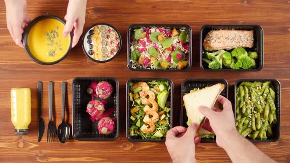 Food Delivery Top View Take Away Meals in Disposable Containers on Wooden Table