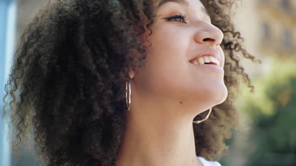 Active Young American Ethnic Woman Jumping Dancing in City Street, Outdoors. Happy Student Girl