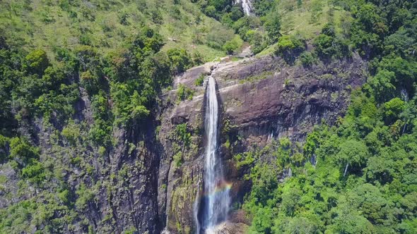 High Diyaluma Falls on Steep Cliff in Green Wild Rainforest