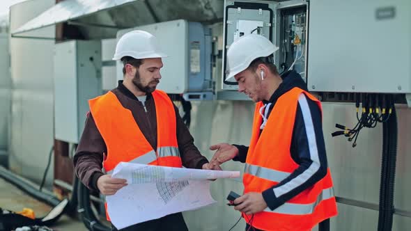 Workers in Protective Uniform Outdoors