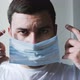 Guy with Small Beard Puts Medical Mask on and Breathes - VideoHive Item for Sale
