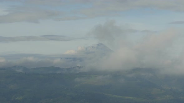 Mountain and land seen through clouds