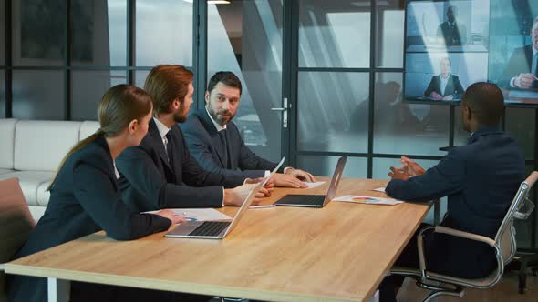 Young people communicating via video call in the office