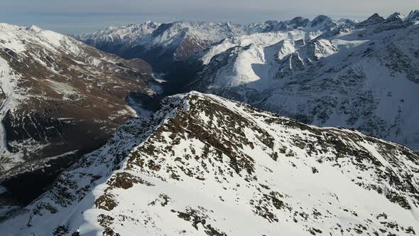 Aerial View of Cheget Mountain Range in Snow in Winter in Sunny Clear Weather