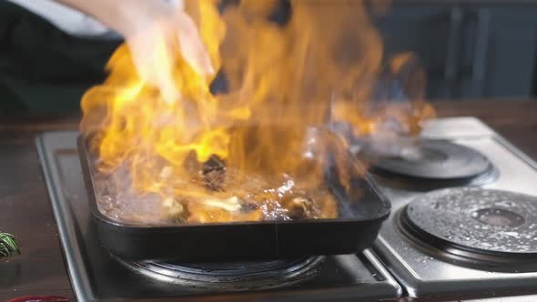 Flambe in restaurant's kitchen