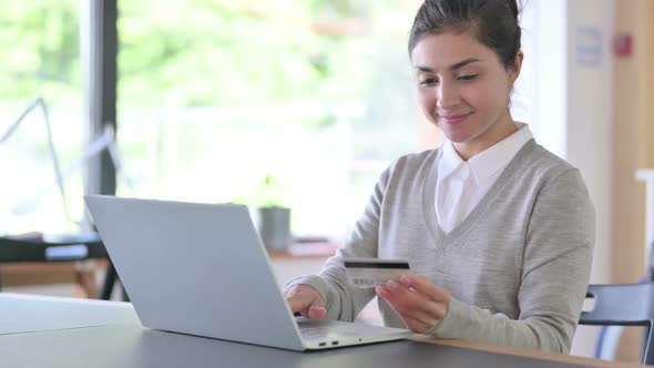 Online Shopping By Indian Woman with Credit Card at Work