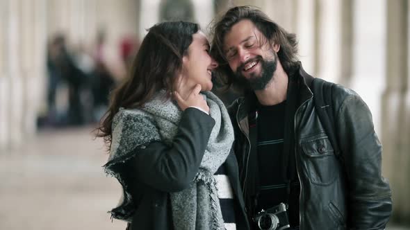 Happy Dating Couple with Photo Camera Standing in Arcade