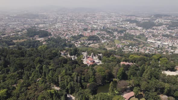 Aerial Wide view over Shrine Bom Jesus do Monte, Sprawling Braga city Background