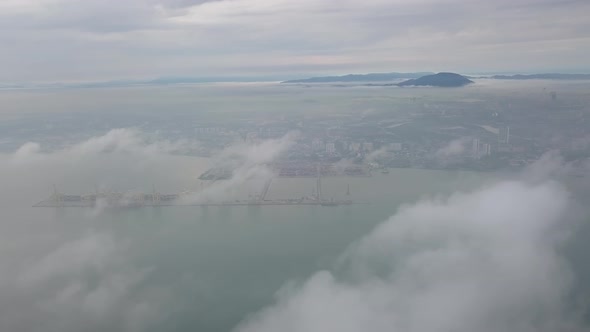 Drone shot low cloud formation at container terminal