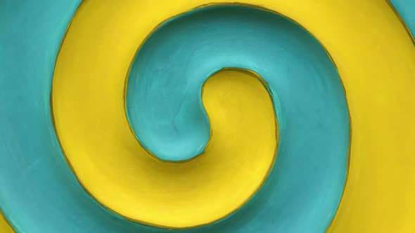 Yellow and teal blue spiral rotation