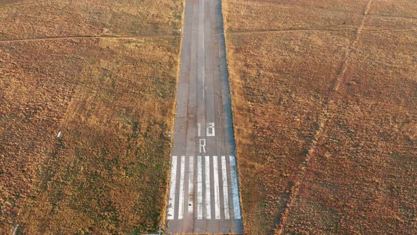 Empty runway of a small airport used for takeoff and landing of light aircraft. Airfield for planes.