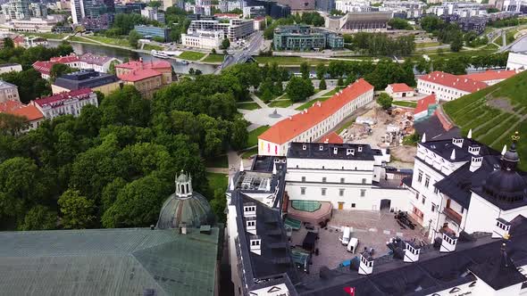 Beautiful white building of Vilnius Royal Palace, aerial descend view