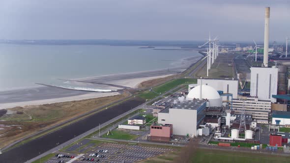 Aerial hot of a nuclear power plant on the coast of the sea in the Netherlands. Energy production by