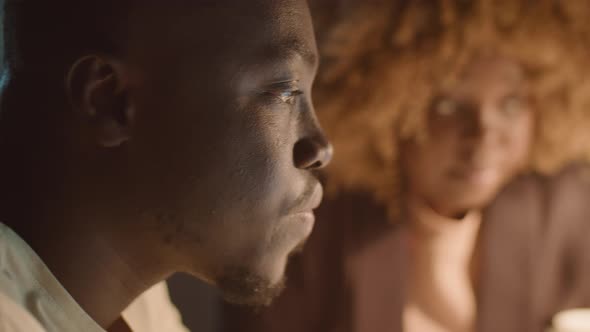 African American Coworkers Talking in Office in Evening