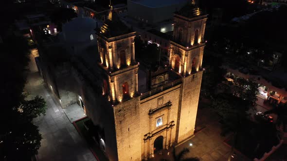 Aerial camera at night looking down on the Cathedral de San Gervasio and then descending in Valladol