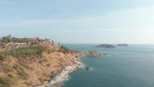 Steep barren hill connecting to Promthep Cape next to Yanui Beach in Phuket, Thailand 