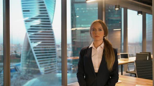 Portrait of Successful Young Business Woman Looking Serious Indoor Office