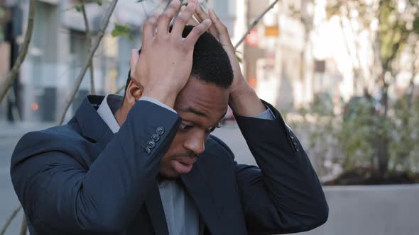 Stressed Exhausted Young Mixed Race Company Employee Having Painful Head Feelings Due to Computer