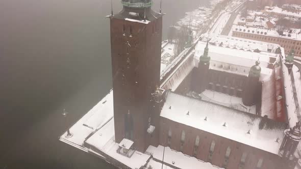 Revolving view of historic Stockholm city during winter storm.