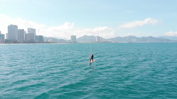 Aerial View of the City Beach and Active People Practicing Kite Surfing and Windsurfing. Kitesurfing