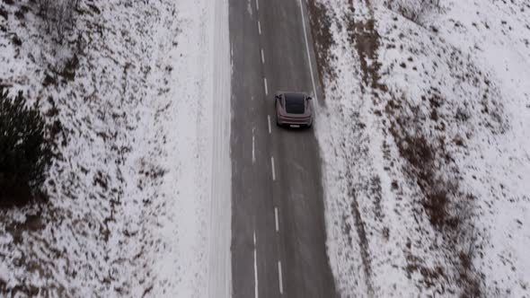 Car in the Mountains of the Caucasus in Winter