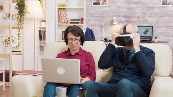 Senior Man Trying a VR Headset in the Living Room