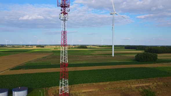 5G Tower and Windmills in the Background