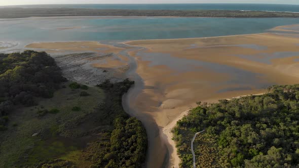 Aerial view of the screw creek river mouth meeting Andersons inlet in Victoria Australia.