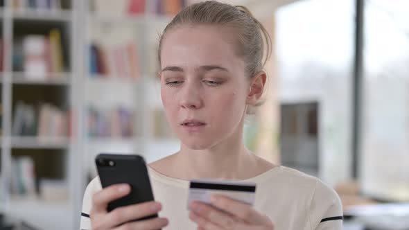 Portrait of Online Payment Failure on Smartphone By Young Woman 