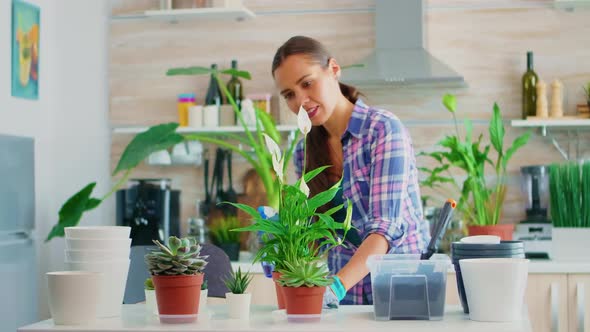 Woman Spaying Plants