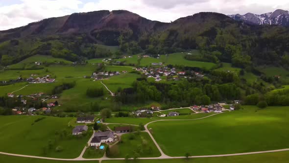 Beautiful view on the Mountains, lake and a Village Drone Video