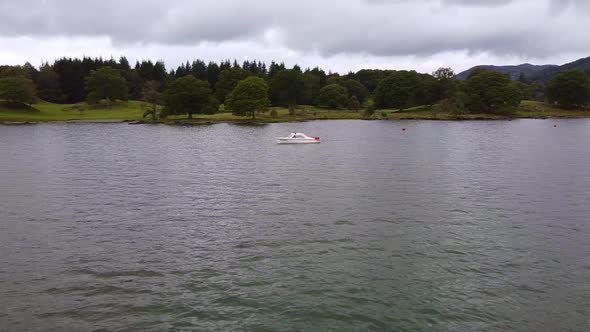 panning aerial shot motorboat lake windermere 2