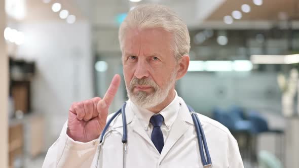 Senior Doctor Showing No Sign By Hand 