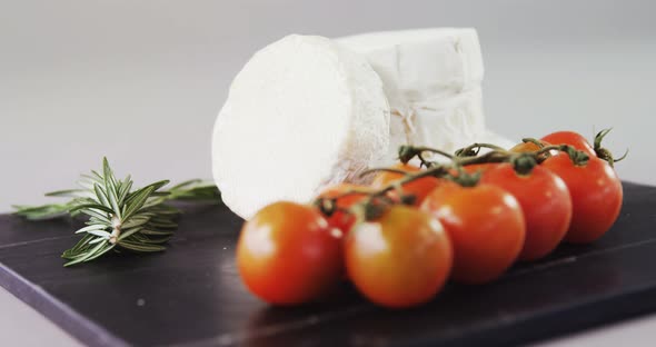 Cheese with tomatoes and rosemary herb