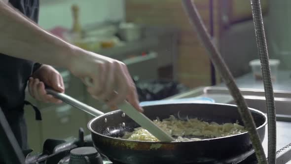 Chef at Work Cooking Sause with Wine