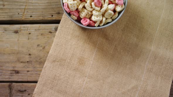 Bowl of honeycomb cereal with spoon