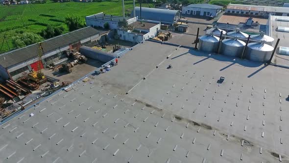 Construction on a rooftop. Building the solar farm on flat roof.