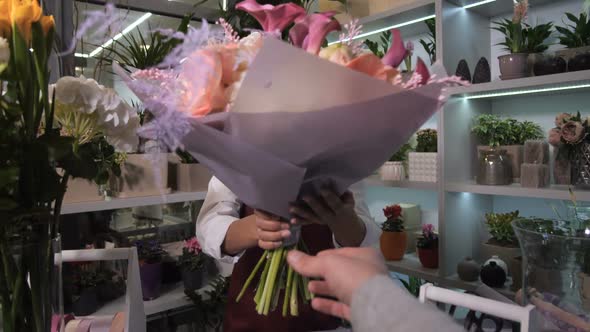 Happy Florist Giving Bouquet To Customer