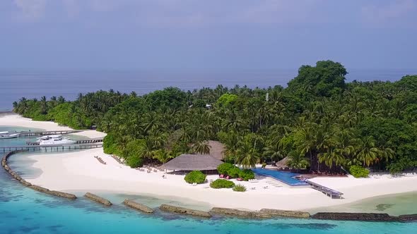 Aerial drone scenery of coast beach journey by blue sea and sand background