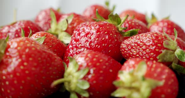 Fresh Strawberries, Rotating Slowly on White Backgraund. Midle Shot