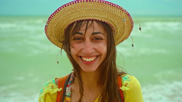 Camera Zooming Out of Closeup Portrait Happy Young Woman in Hat Enjoying Sea Beach Getaway Vacation