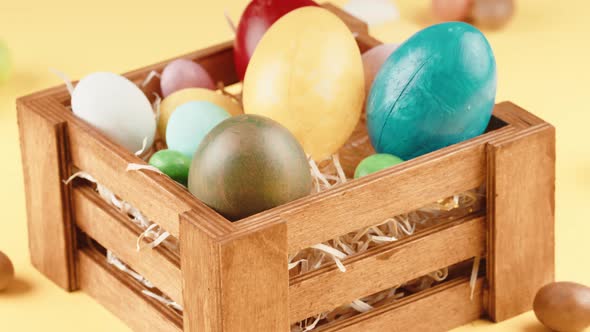 Basket of Easter Eggs That Turns with a Yellow Background