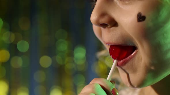 Closeup Shot of Stylish Teenager Caucasian Kid Girl Lips Licking Lollipop with Tongue Slow Motion