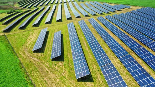 Stunning aerial view of solar panels on green field