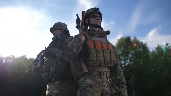 Squad of Military Soldiers in Full Gear at Sunset