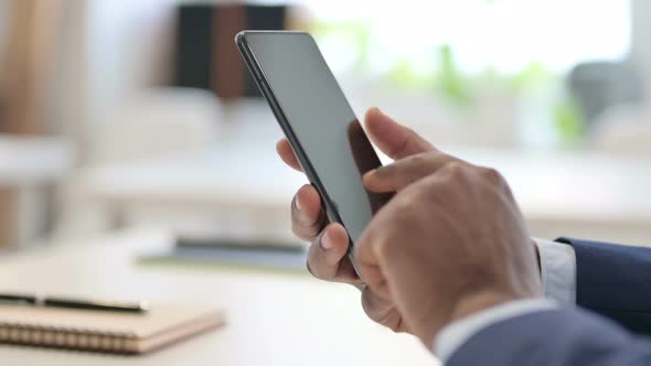 Close Up of Hands of Businessman Using Smartphone