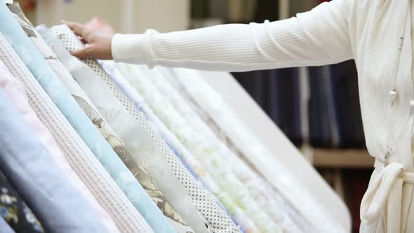 A Beautiful Girl Shopper in a Fabric Store