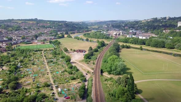 Flying over farmland and railroad tracks, outskirts of Exeter, England